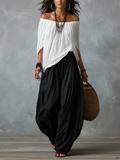 Damaris | Conjunto de Blusa Blanca con Hombros Descubiertos y Pantalón Palazzo Negro